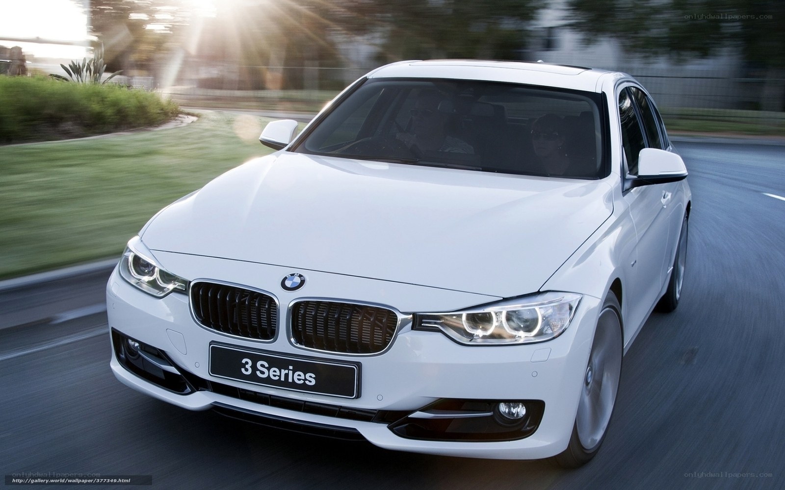 White BMW 3 Series in motion