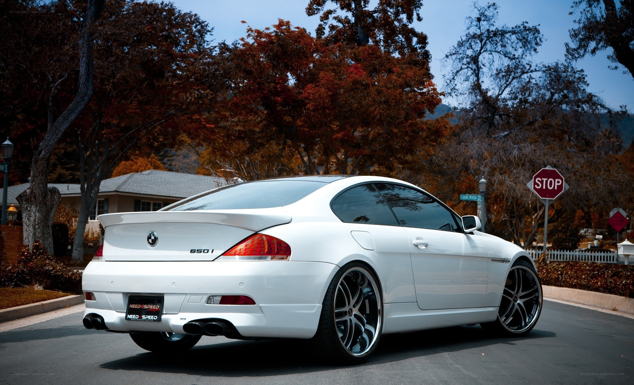 White BMW 650i on a street