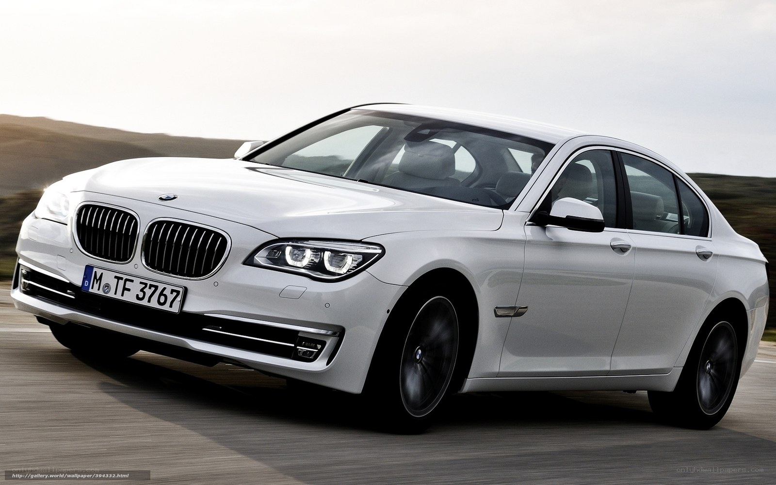 White BMW 7 Series in motion