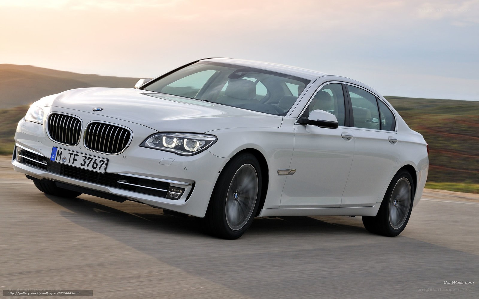 white bmw 7-series in motion