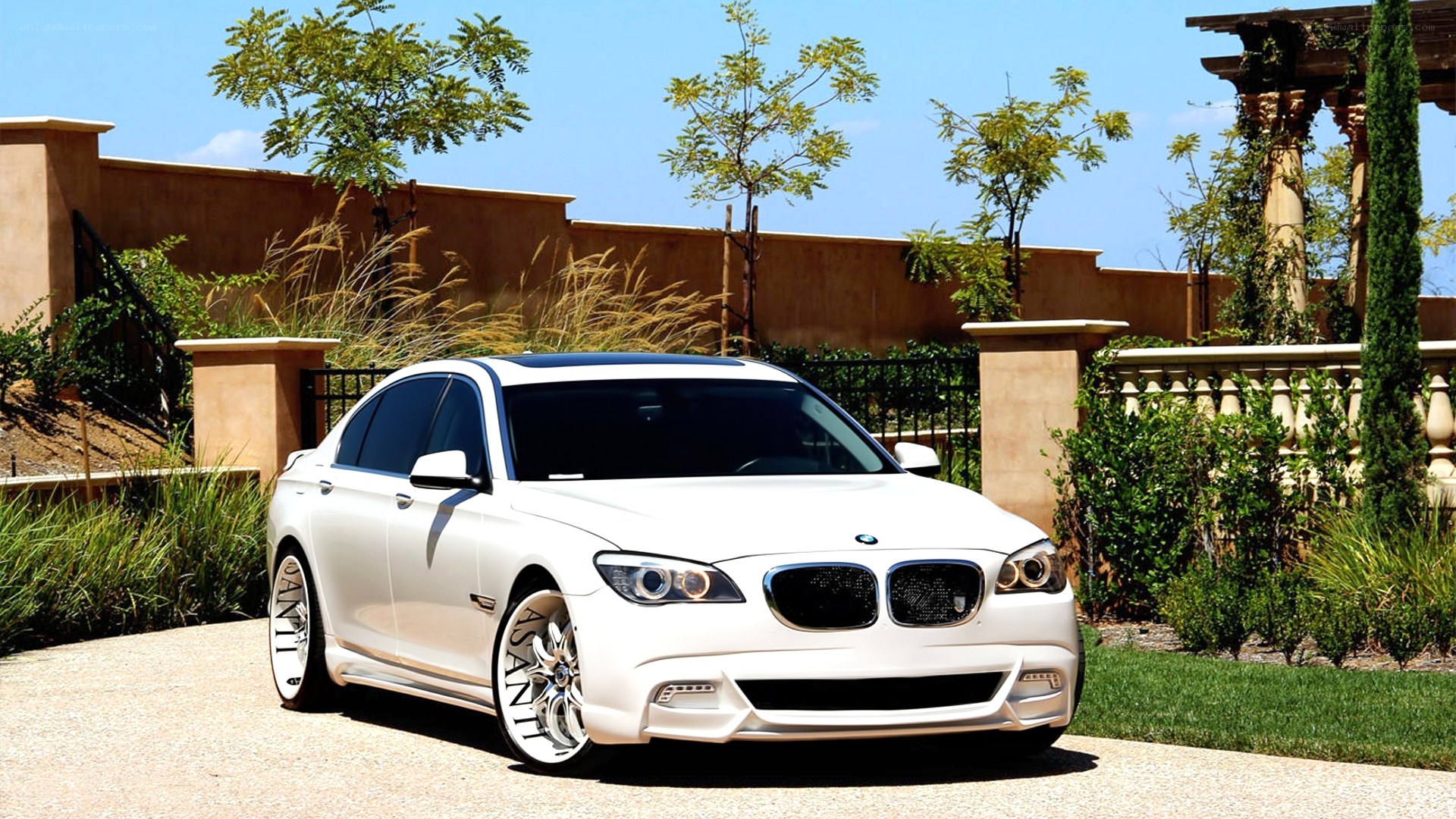 White BMW 7 Series sedan