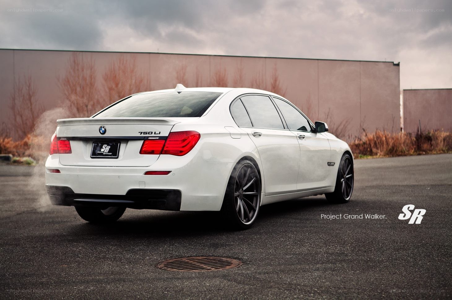 White BMW 750 Li sedan