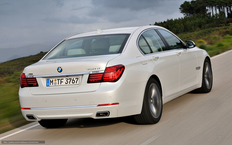 white bmw 750d in motion