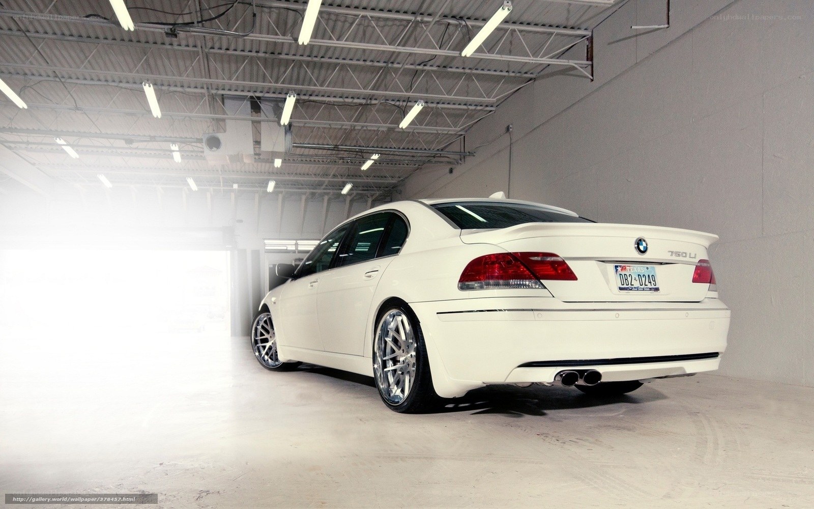 white bmw 750li in garage