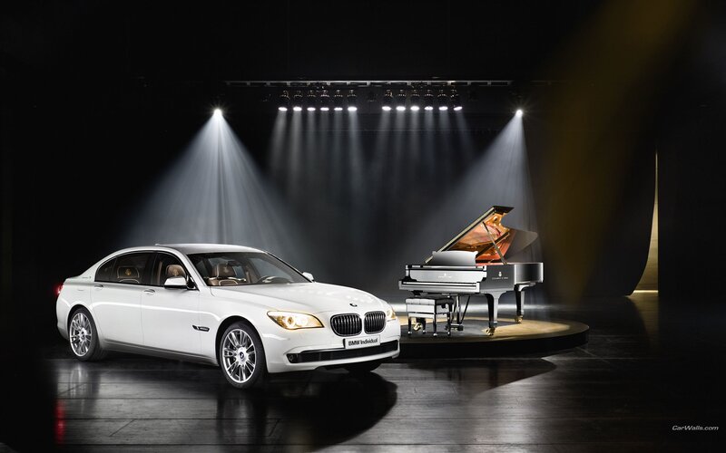 White BMW and grand piano