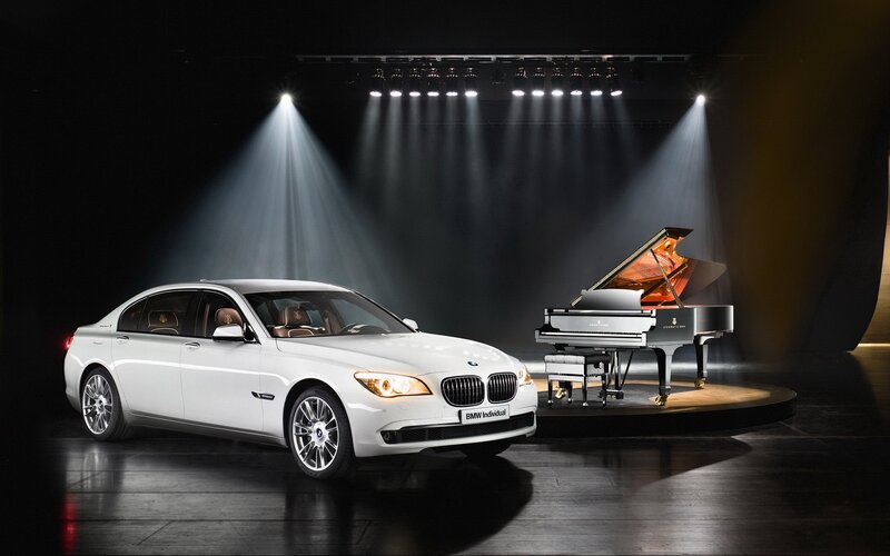 White BMW and grand piano