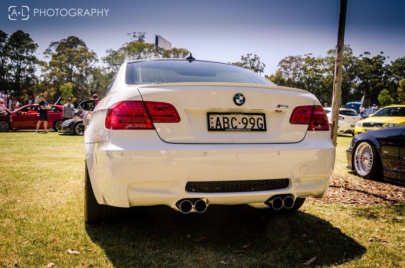 white bmw at car show