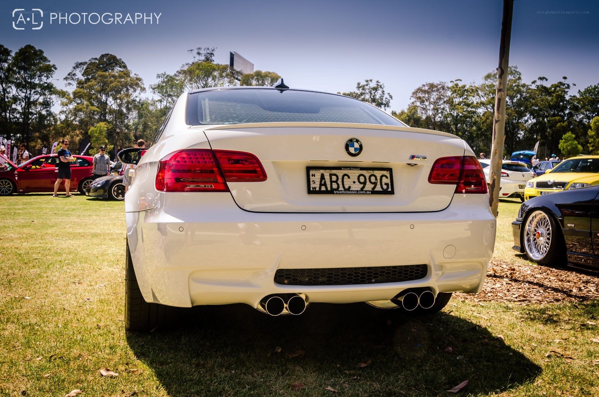 white bmw at car show