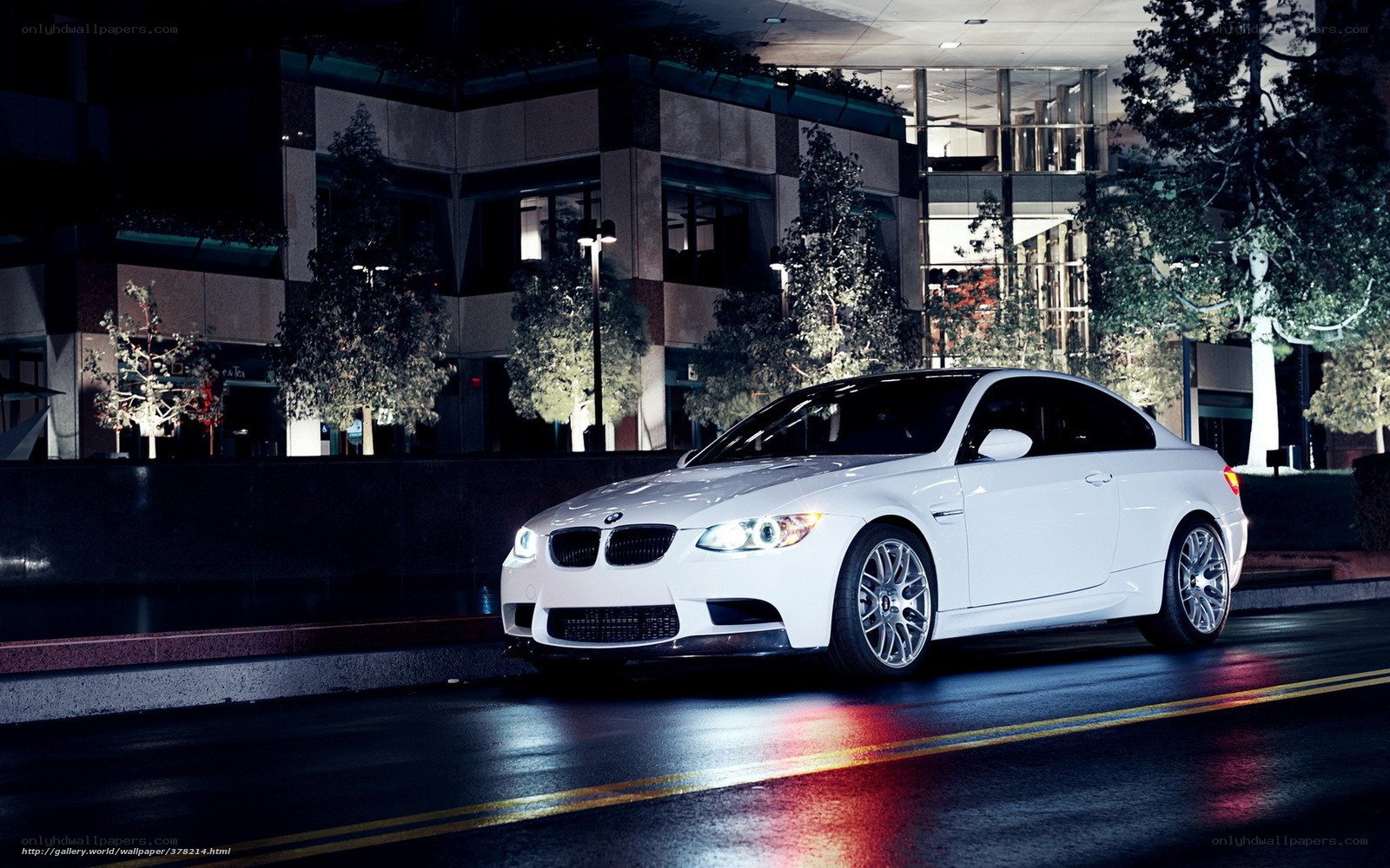 White BMW at night in city