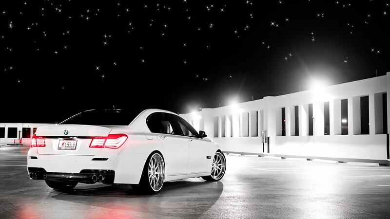 White BMW at night with stars