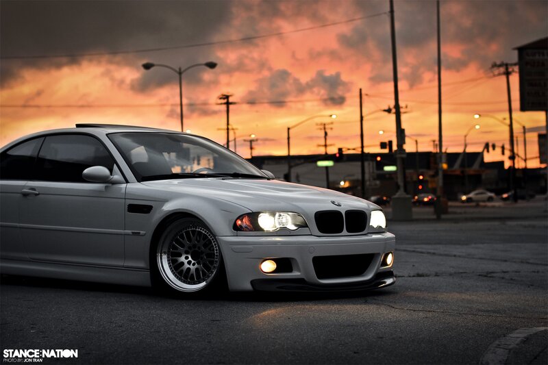 white bmw at sunset
