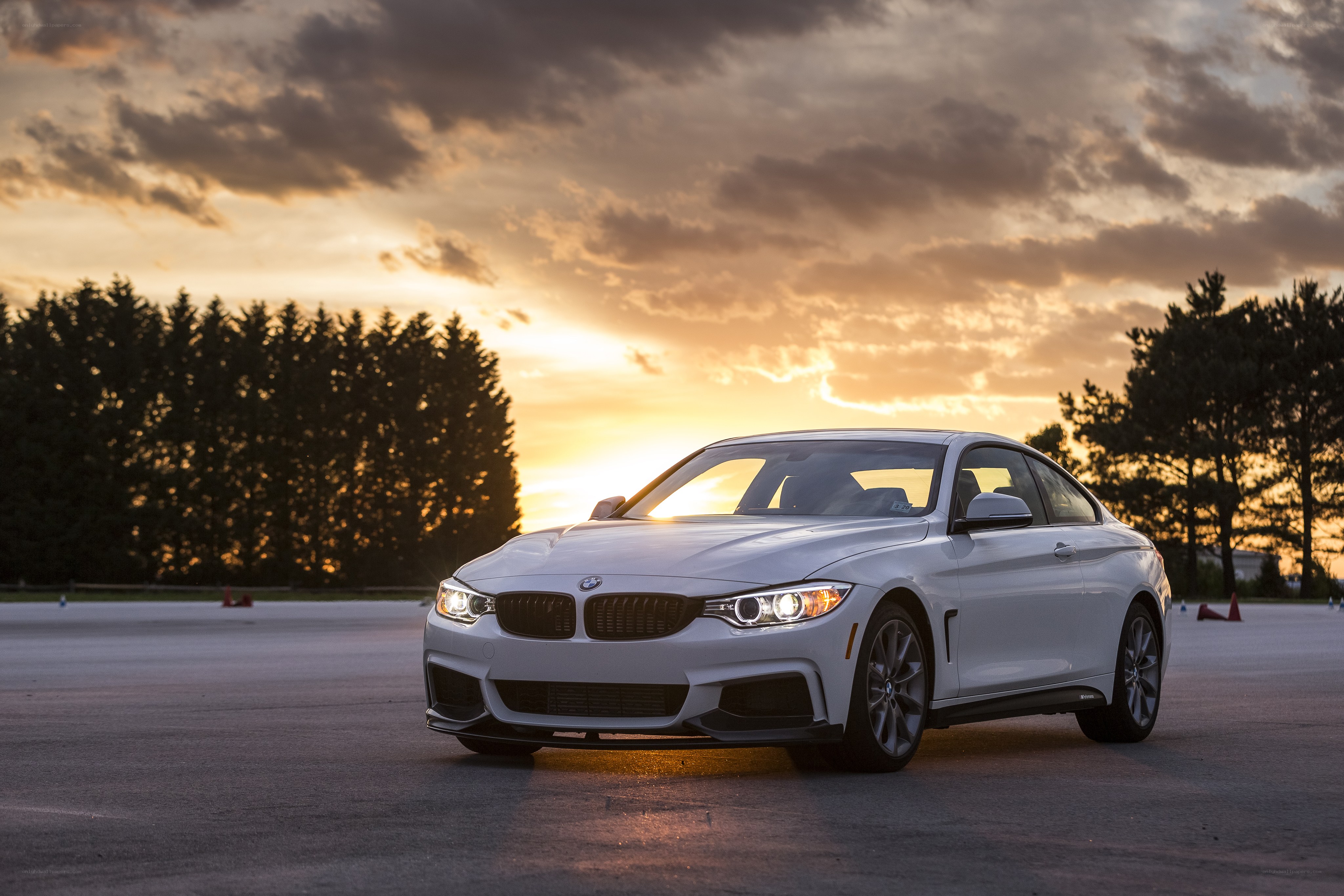 White BMW at sunset