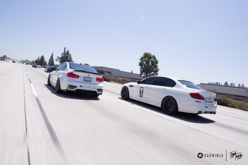 White BMW Cars on Highway