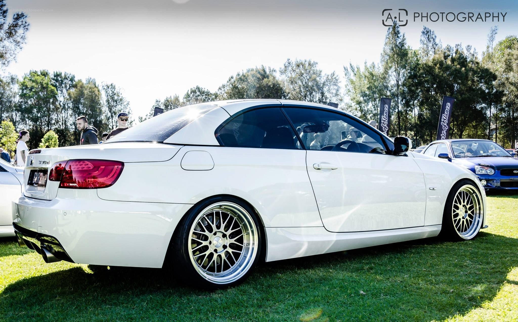 white bmw convertible at car show
