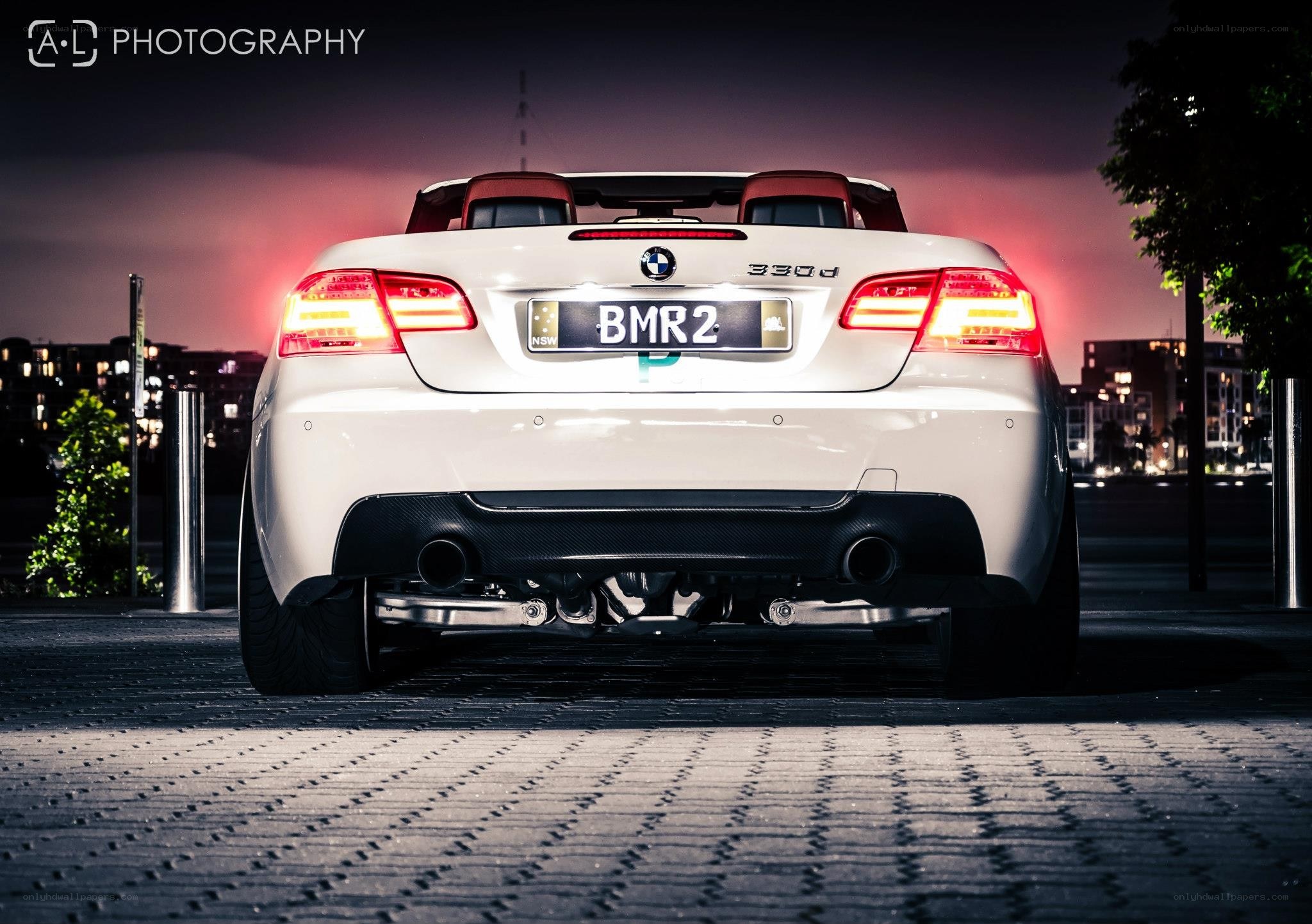 White BMW convertible at night