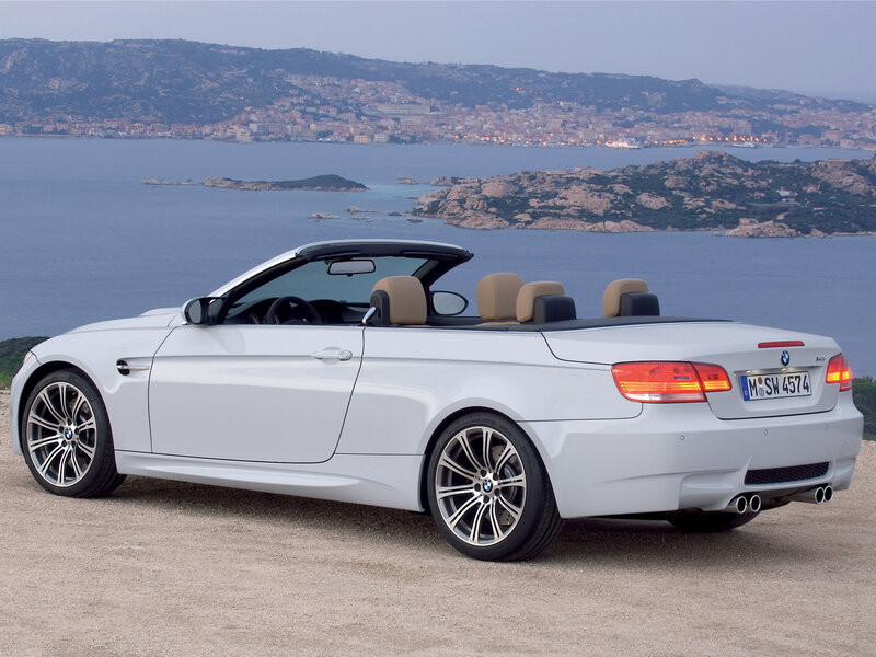 White BMW convertible by the sea