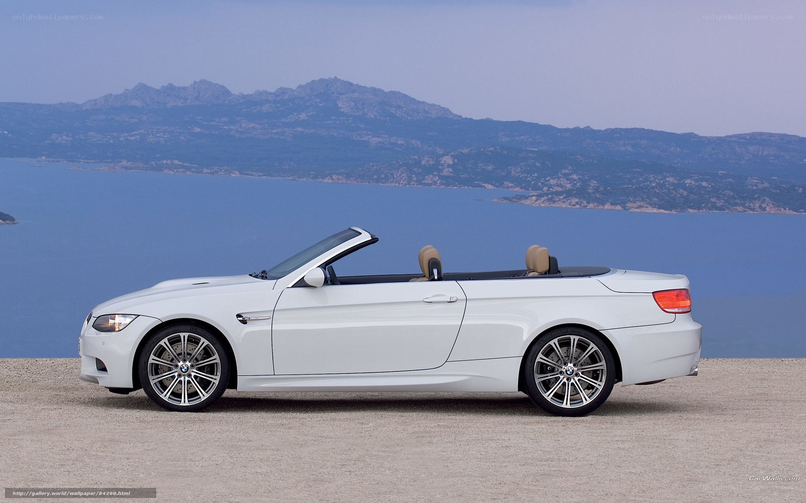 White BMW convertible by the sea