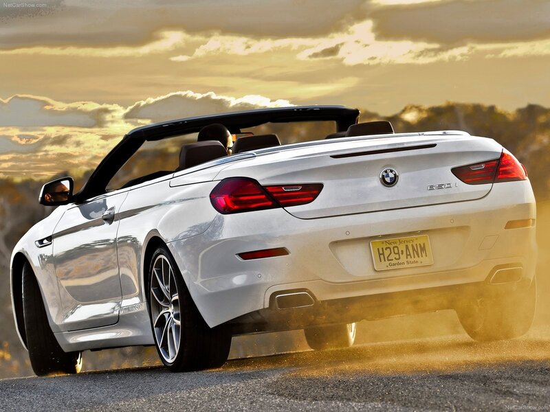 White BMW convertible driving