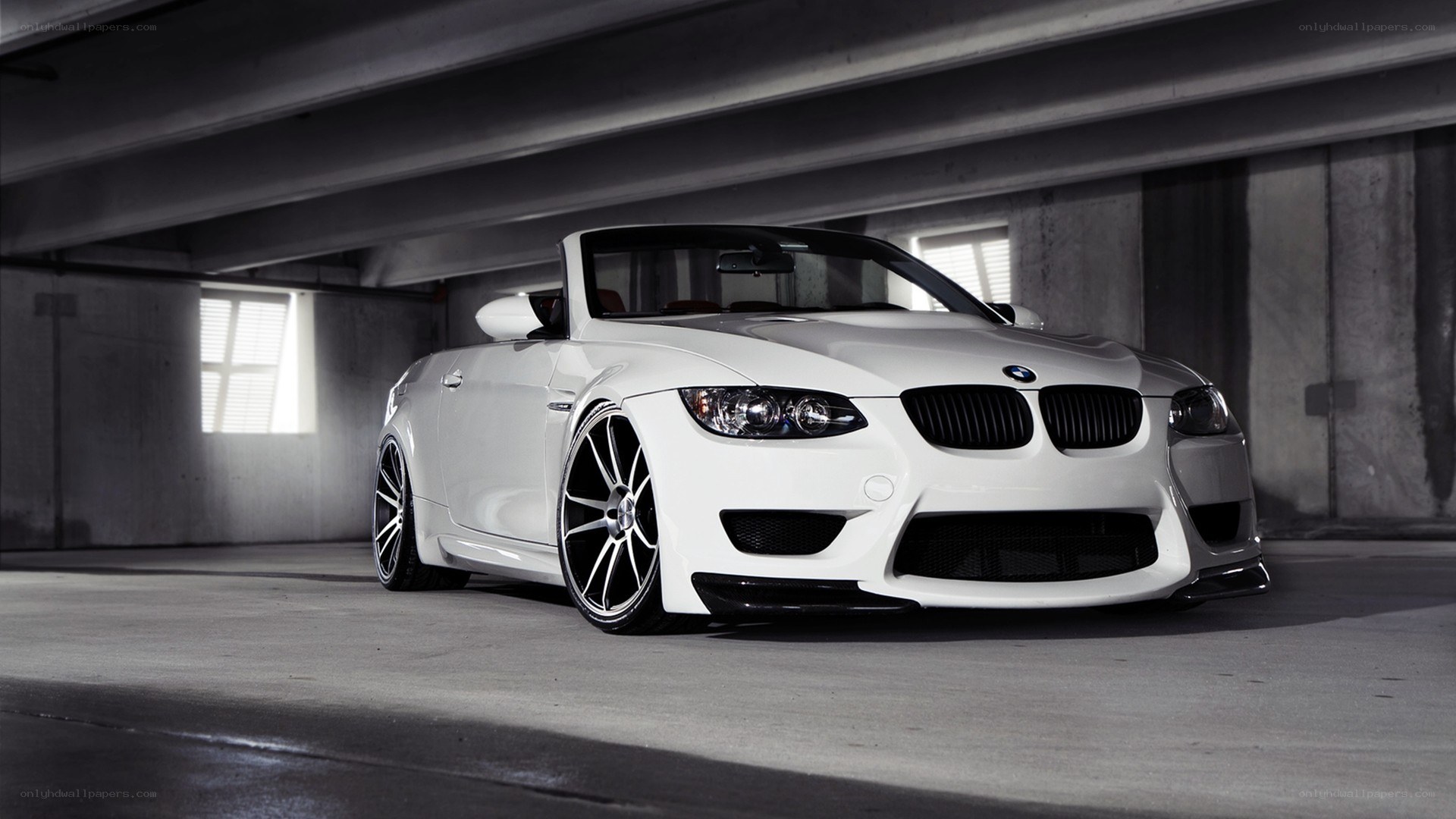 white bmw convertible in garage