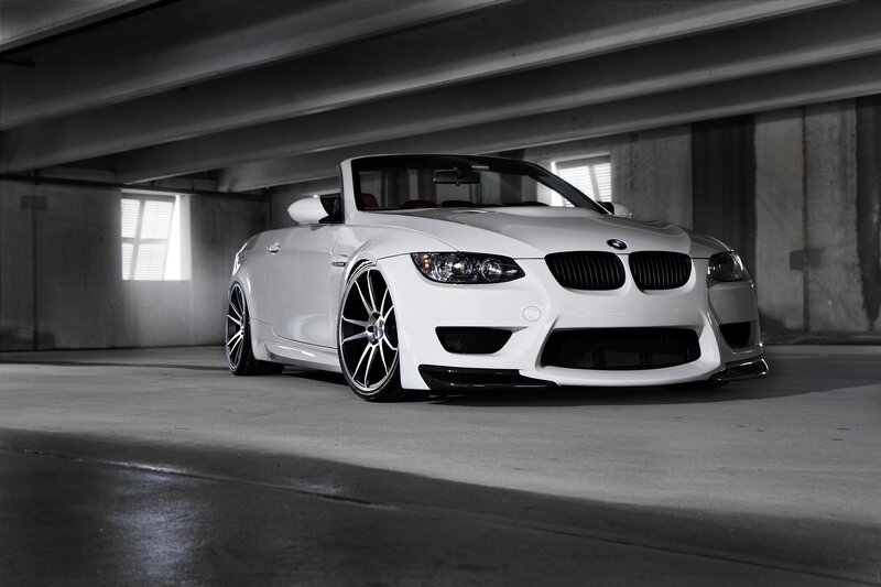 white bmw convertible in garage