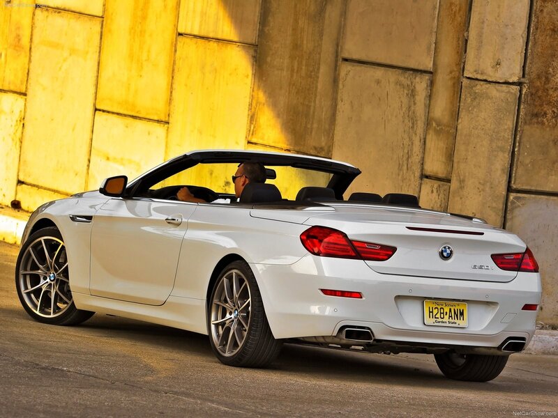 White BMW convertible on city street