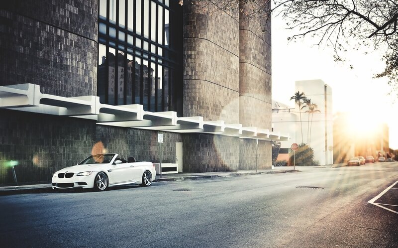 White BMW convertible on city street