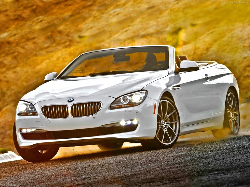 White BMW convertible on road