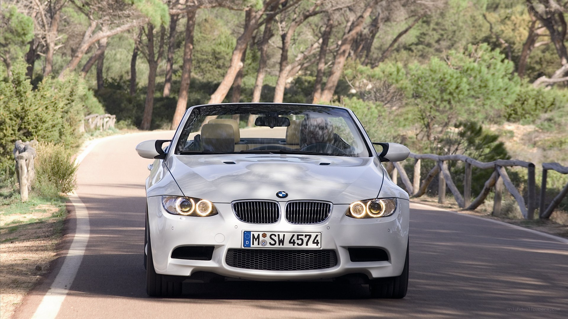 white bmw convertible on road