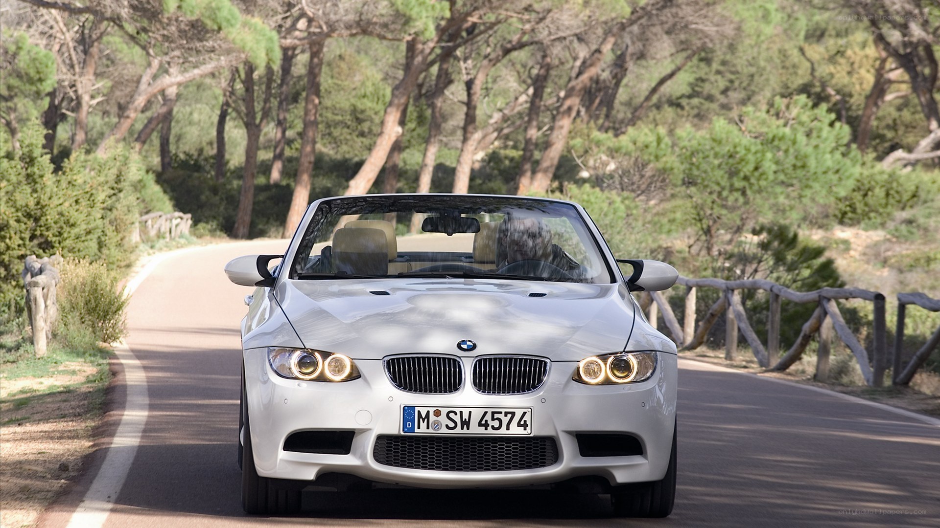 white bmw convertible on road