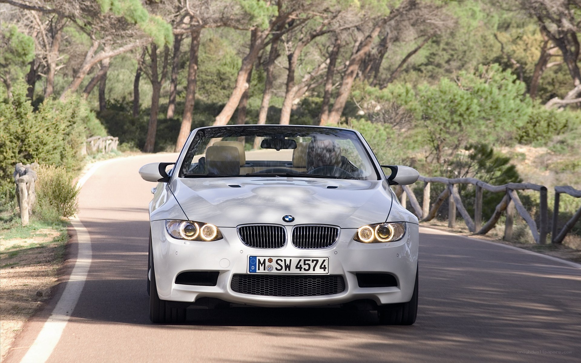 white bmw convertible on road