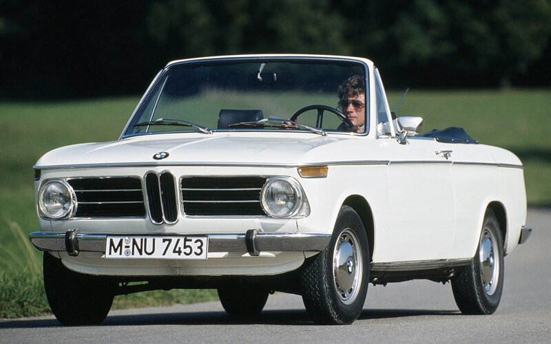White BMW convertible on road