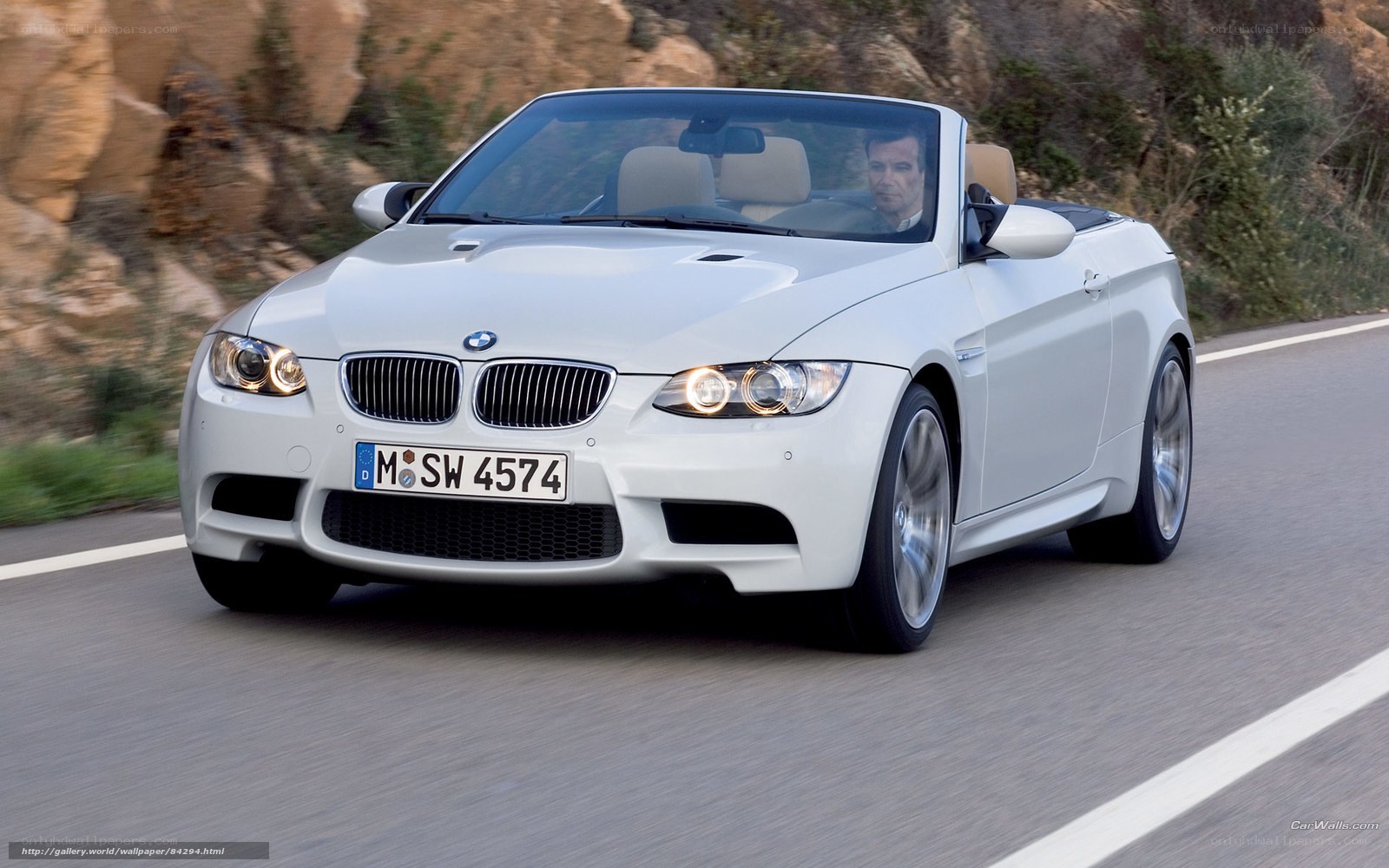 white bmw convertible on road