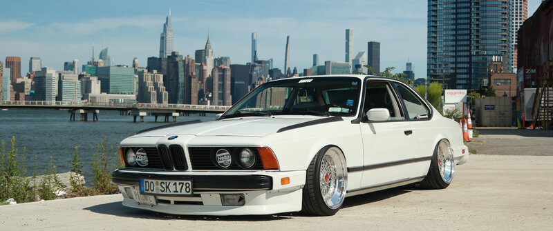 White BMW Coupe — Calm, Afternoon, Photograph, City Skyline