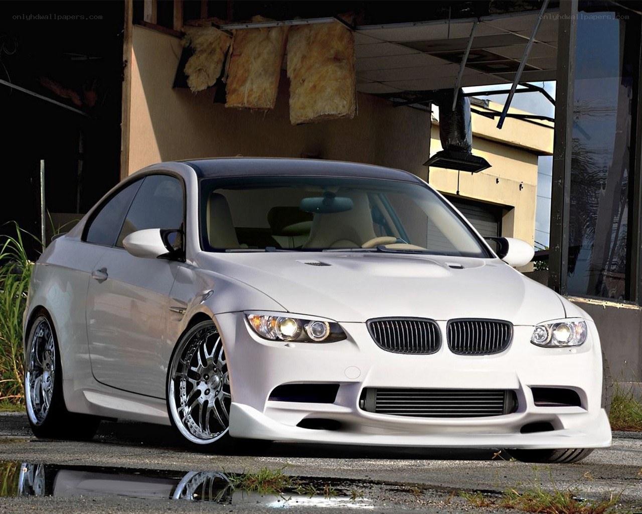 white bmw coupe in garage