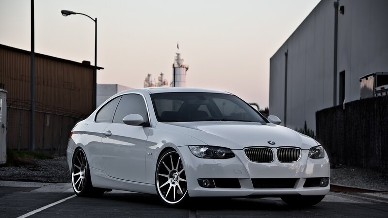 White BMW coupe in industrial area
