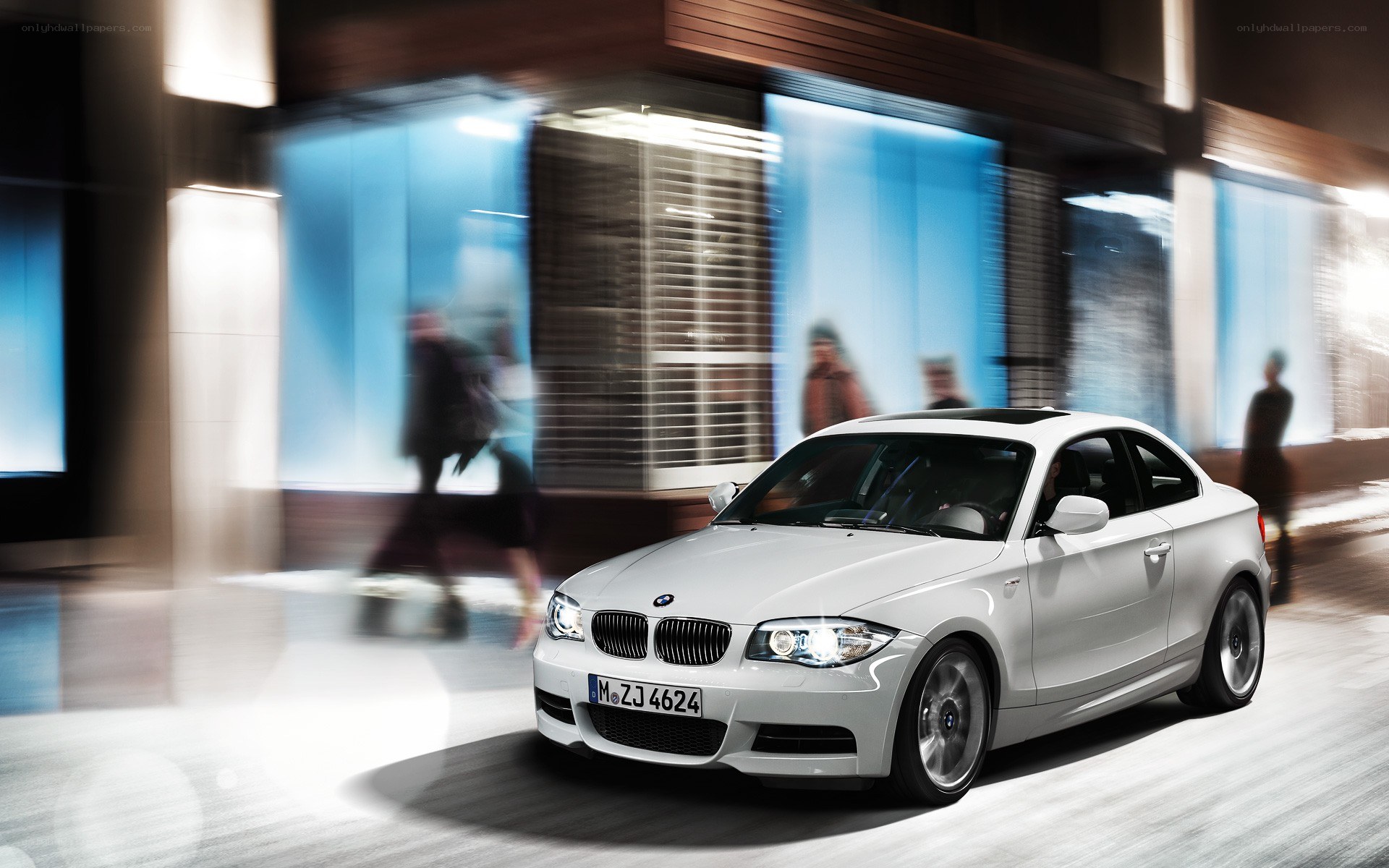 White BMW coupe in motion