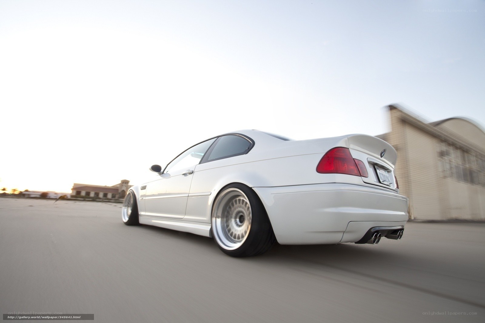white bmw coupe in motion