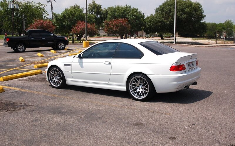 white bmw coupe in parking lot