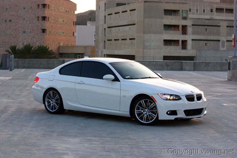white bmw coupe in parking lot
