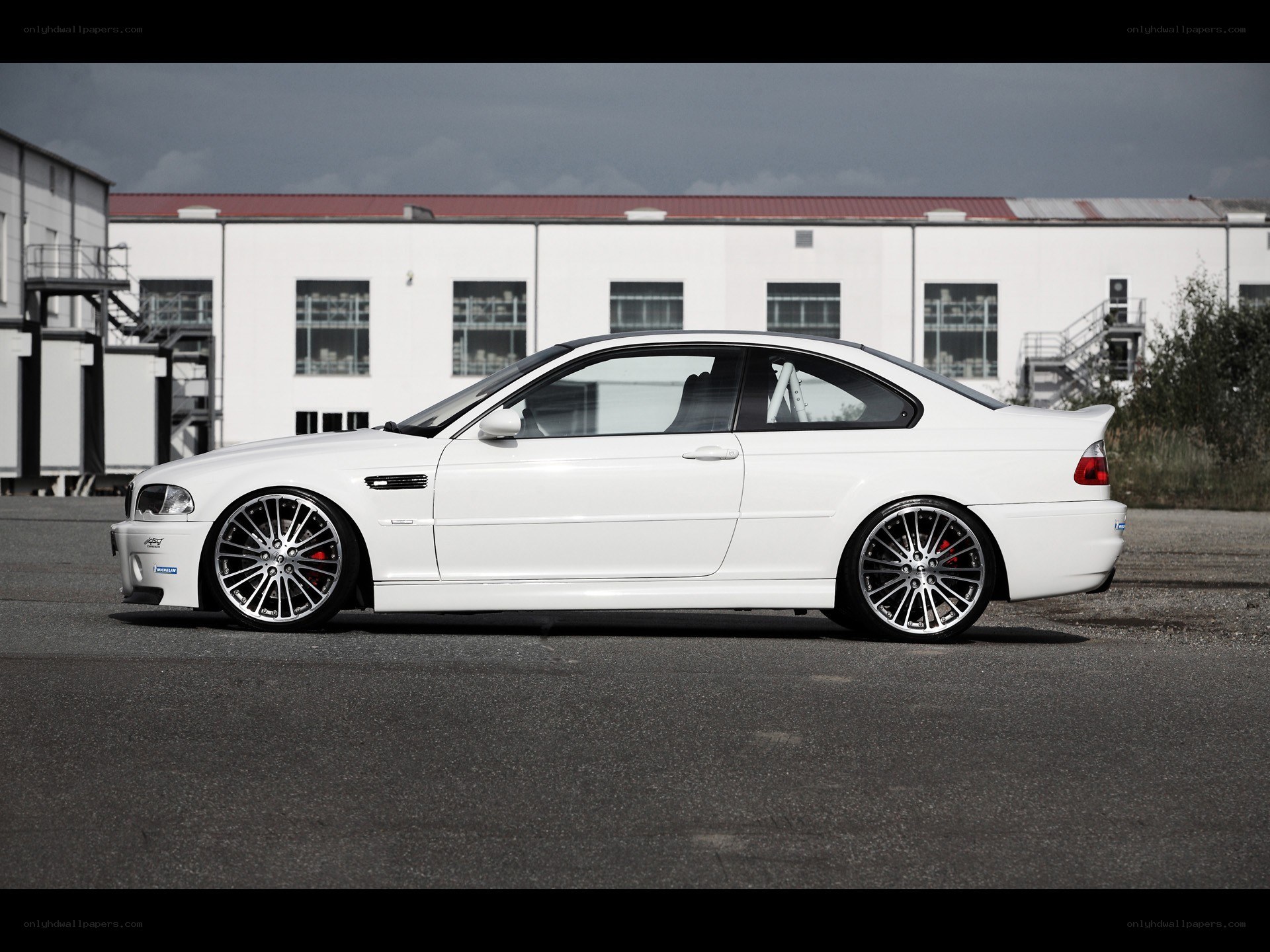 white bmw coupe on asphalt