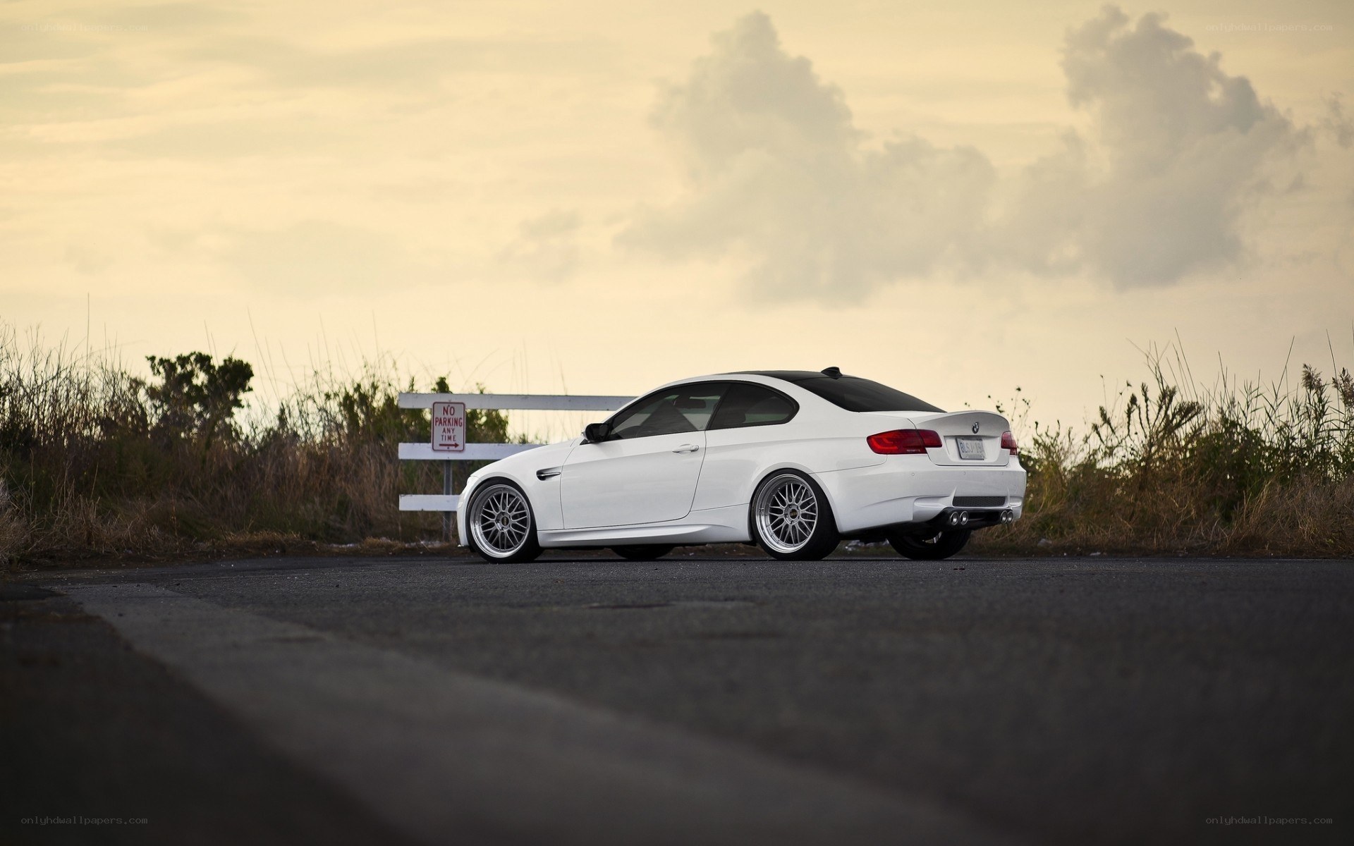 white bmw coupe on road