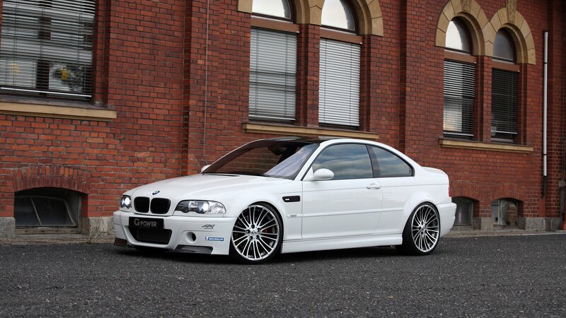 white bmw coupe on street