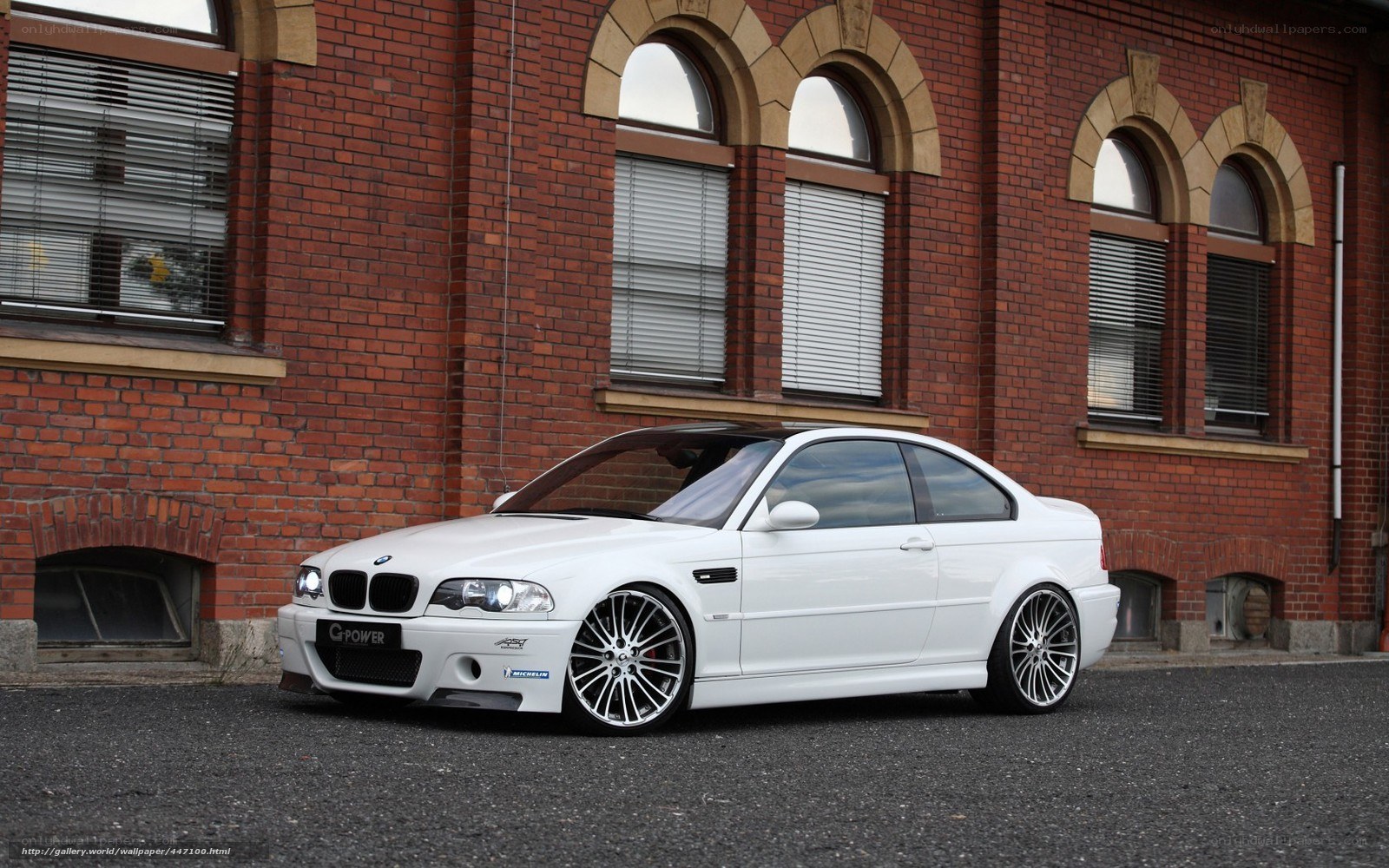 white bmw coupe on street