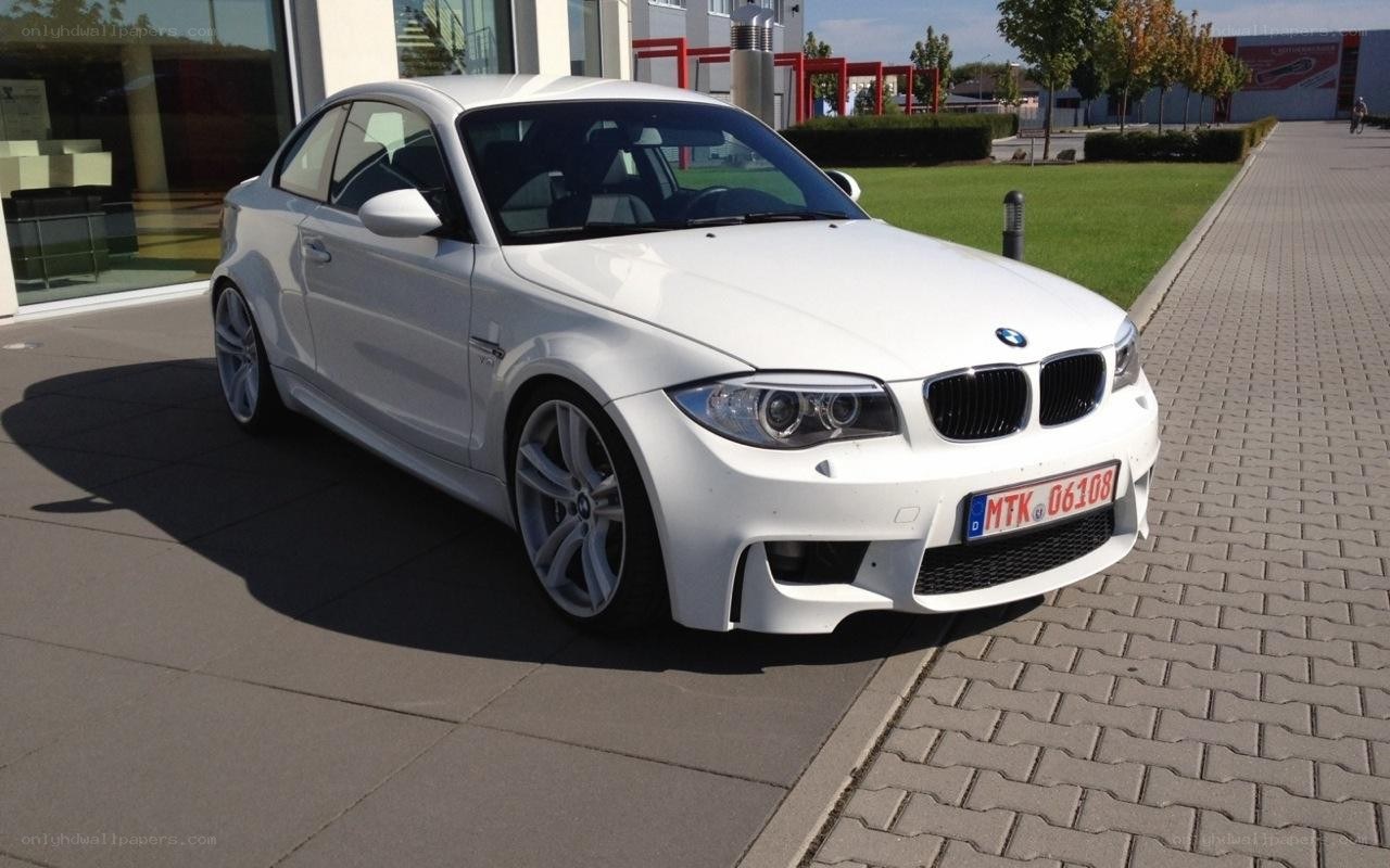 white bmw coupe parked outside