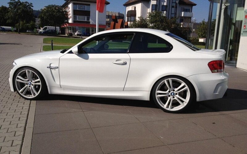 white bmw coupe parked outside