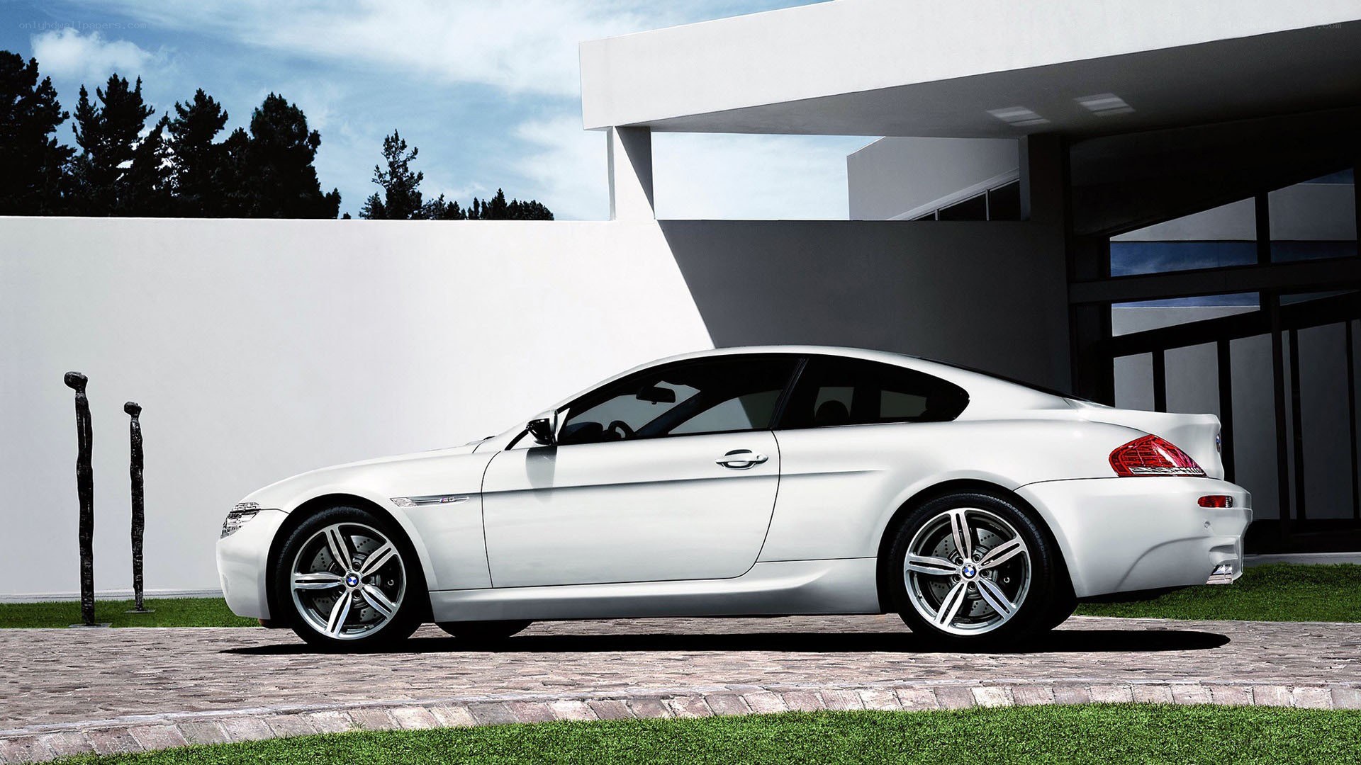 White BMW coupe parked outside