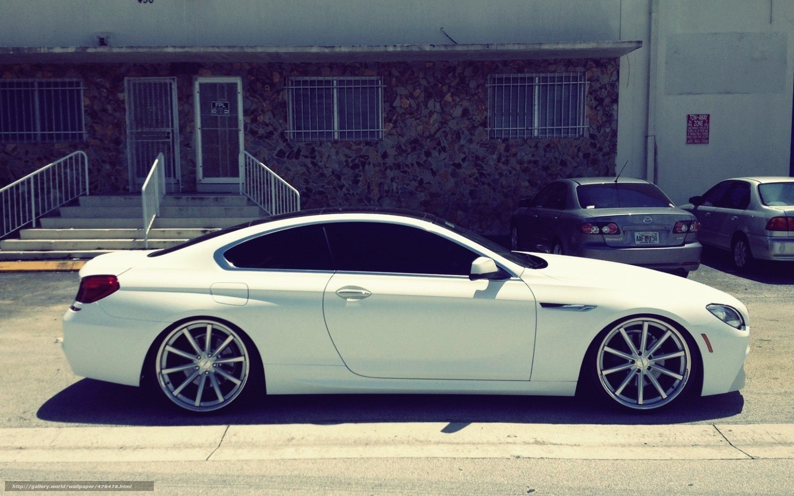 white bmw coupe parked