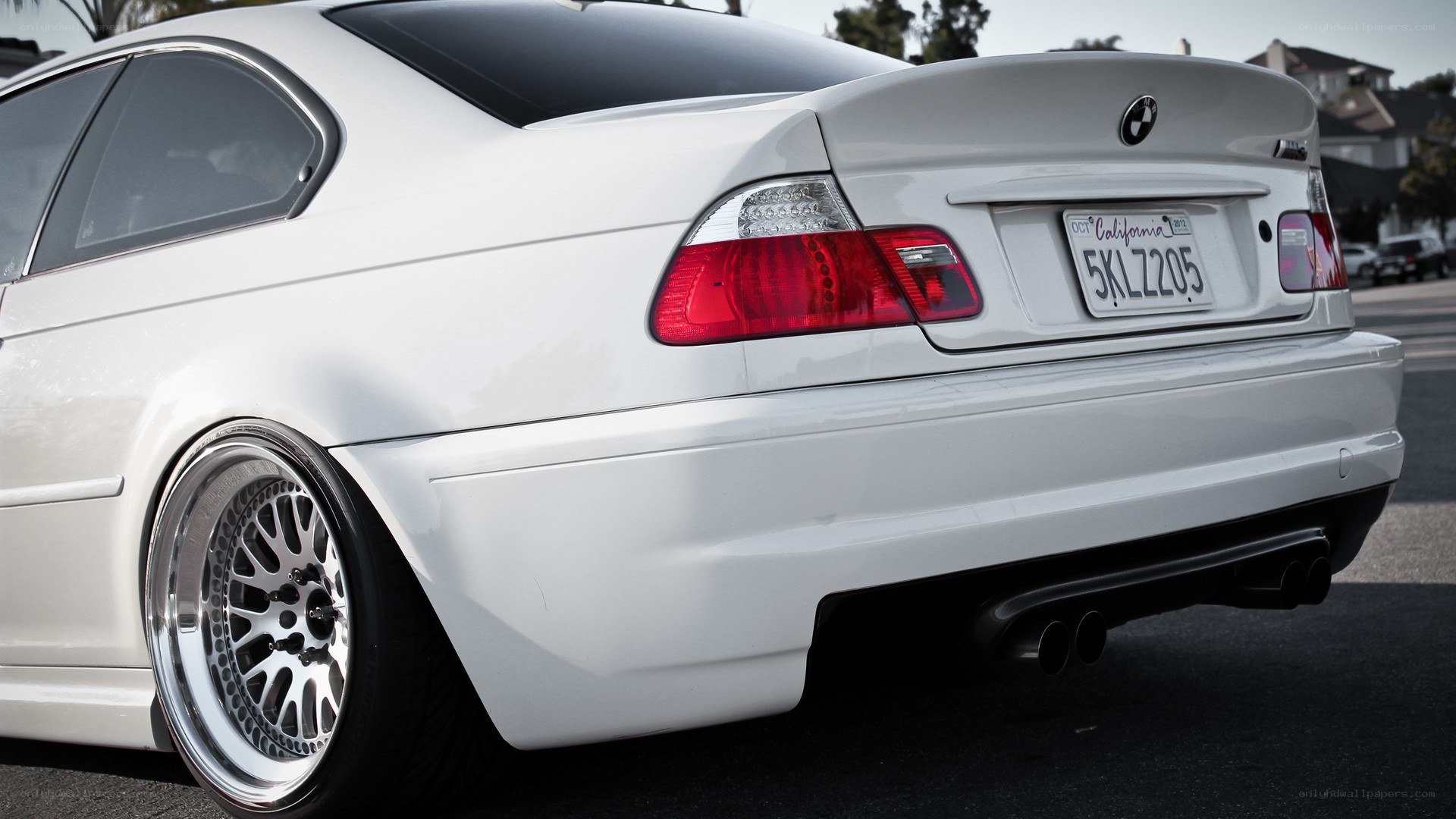 white bmw coupe rear view