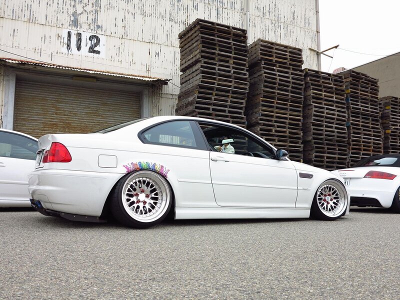 White BMW coupe with custom wheels