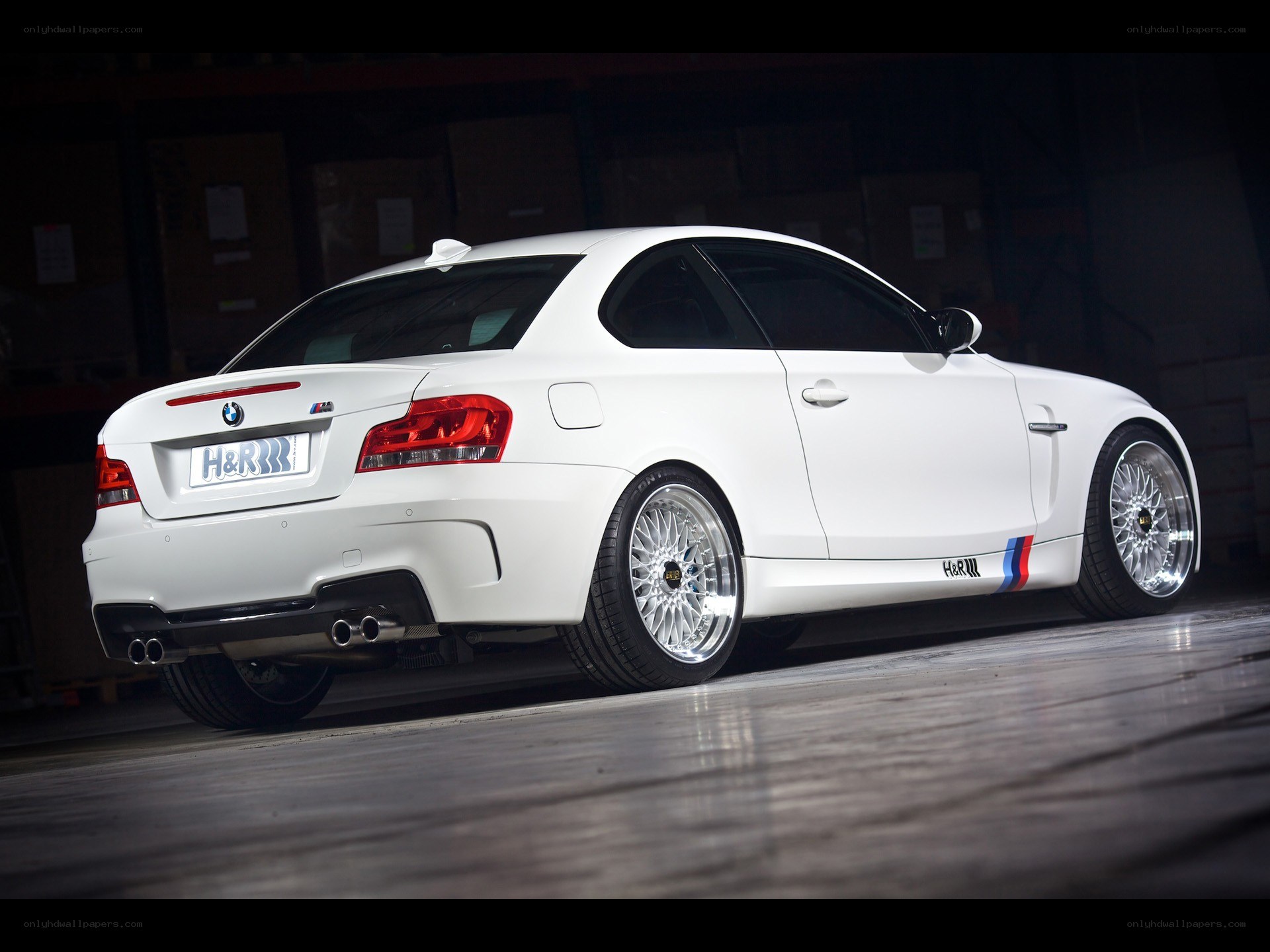 white bmw coupe with custom wheels